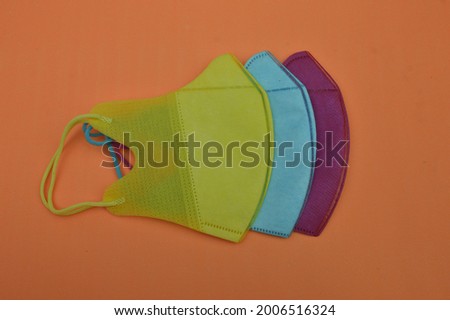 The colorful Mask for corona virus protection, isolated on yellow backgrond. Can use for everyone, get health