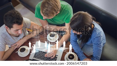 Composition of network of digital icons over people using laptop. global business, digital interface, technology and networking concept digitally generated image.