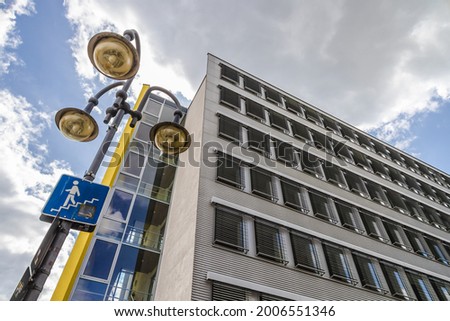 Picture from historic office building with street lightning on a sunny day in Germany