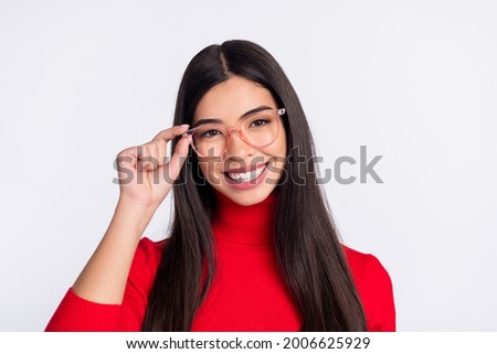 Photo of young happy cheerful beautiful attractive intelligent asian girl in glasses isolated on grey color background