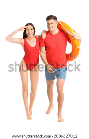 Beach rescuers with lifebuoy on white background