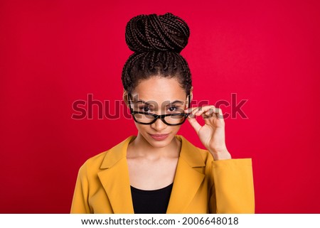 Photo of strict teacher lady touch eyewear wear yellow cardigan isolated on vivid red color background