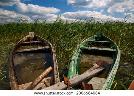 Svitiaz Lake, Shatsk National Natural Park, Volyn region, Ukraine. The Shatskyi Lakes group. Boat on the shore of the lake. Beach by the lake.