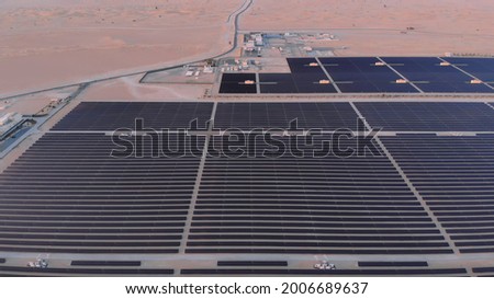 AERIAL. Top view of huge power plant and solar panel at UAE. Royalty-Free Stock Photo #2006689637