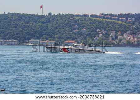 istanbul, coast guard speed boat coastal safety , search and rescue boat navy ship boat, istanbul city Turkey  landscape coastal urban view from at background, traffic marine security