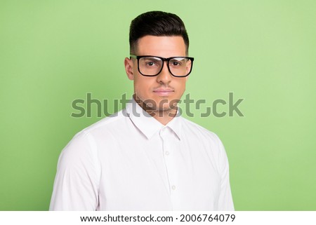 Photo of pretty confident young guy dressed white shirt glasses isolated green color background