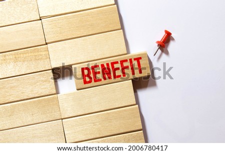 BENEFIT word made with building blocks isolated on white.