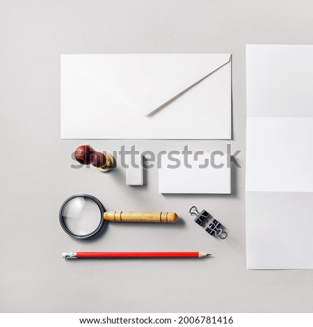 Photo of blank stationery set on paper background. Corporate identity template. Responsive design mockup. Top view. Flat lay.