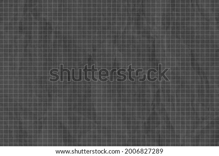 Crumpled dark gray grid paper textured background Royalty-Free Stock Photo #2006827289