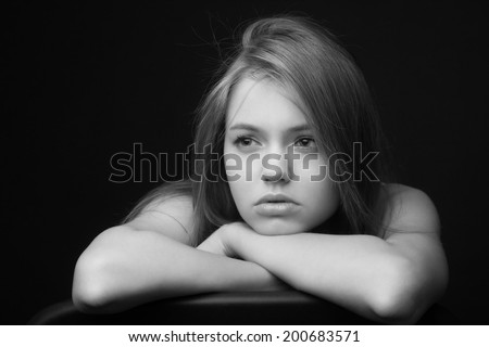 Low Key shoot of beautiful sad and thoughtful girl Royalty-Free Stock Photo #200683571