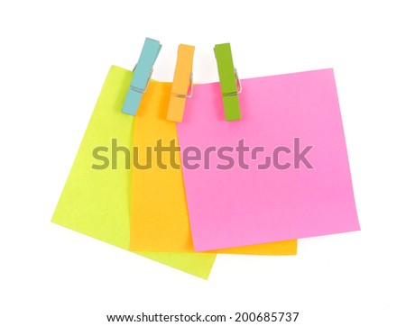 paper notes and clothespins isolated on white background