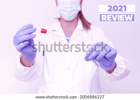 Text caption presenting 2021 Review. Conceptual photo remembering past year events main actions or good shows Presenting And Analyzing Medical Specimen Displaying Test Samples