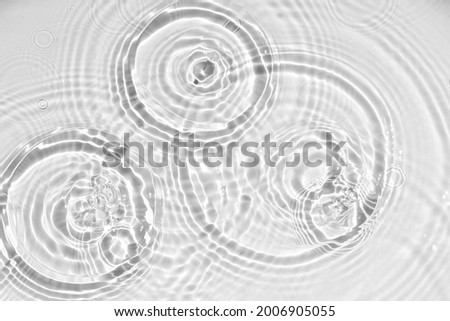 White water texture, blue mint water surface with rings and ripples. Spa concept background. Flat lay, copy space. Royalty-Free Stock Photo #2006905055