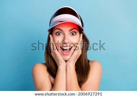 Photo of young girl happy positive smile hands touch cheeks amazed excited isolated over blue color background