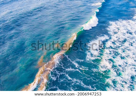 Aerial top view sea amazing nature background. Turquoise and clear water of ocean at sunny day.