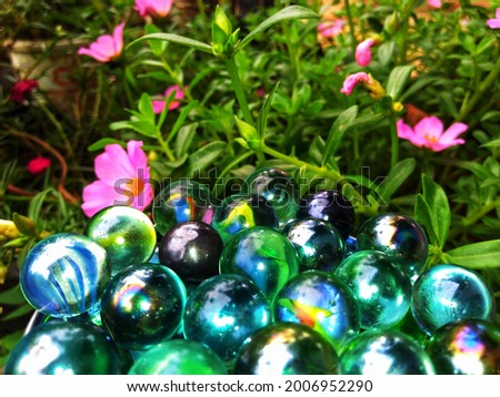 Marbles are one of the toys that are liked by small children, especially boys together