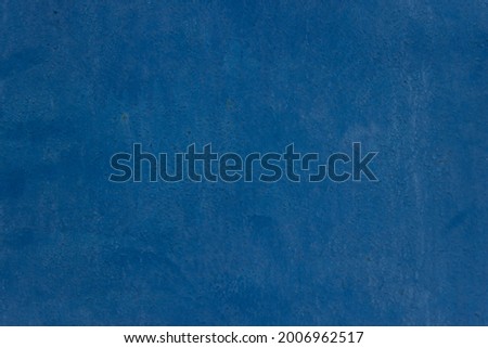 Blue paint on old metal wall texture	
