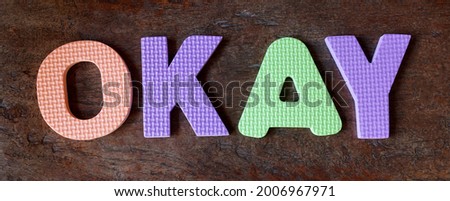 OKAY word, writes with foam mat puzzle                               