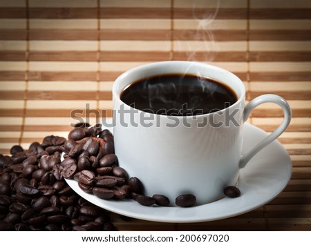 Coffee cup and saucer on a wooden