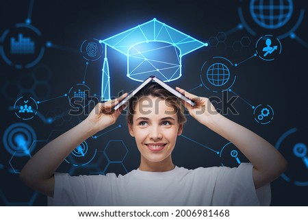 Smiling businesswoman holding an open book on her head and pondering about educational prospective in future career, master degree programs in business administration, postgraduate level. Royalty-Free Stock Photo #2006981468