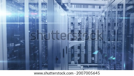 Image of data processing and digital information over network of computer servers with white light trails flashing. global network of internet service provider, data processing centre concept.