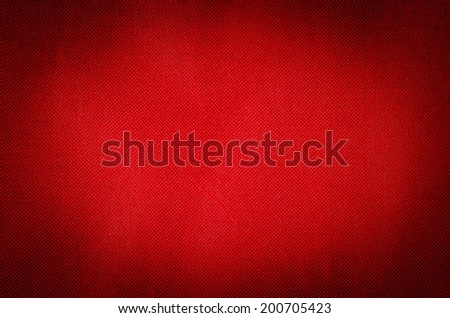 red fabric textile background vignetted
