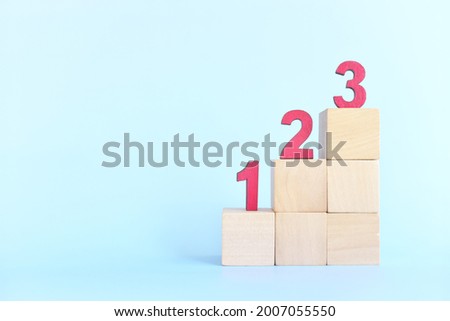 123 numbers on stairs wooden blocks. Small steps towards goal or step by step to success concept. Royalty-Free Stock Photo #2007055550