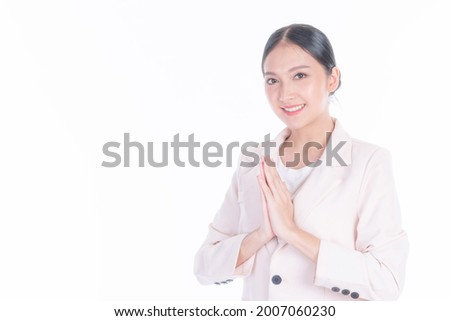 Portrait beautiful working Asian business woman pay respect , sawasdee symbol from Thailand greeting culture for hello or goodbye on white background Royalty-Free Stock Photo #2007060230