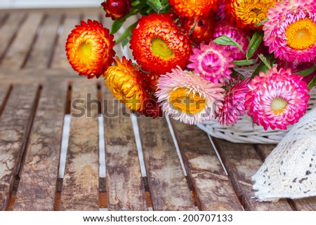 Bouquet of fresh Everlasting flowers bouquet  on wooden table