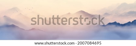Misty mountains with gentle slopes and flock of birds in sunrise sky. Traditional oriental ink painting sumi-e, u-sin, go-hua Royalty-Free Stock Photo #2007084695