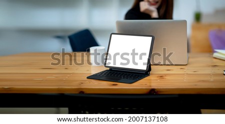 Workplace concept, Mockup blank screen tablet with blank white screen in office modern.