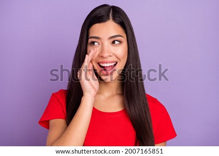 Photo of funky sweet woman dressed red t-shirt arm mouth making announcement looking empty space isolated purple color background