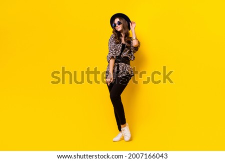 Full length photo of charming nice pretty young woman wear hat sunglass isolated on shine yellow color background