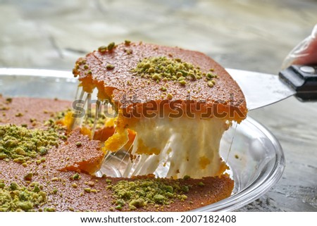 Traditional Arabian Kanafe  with Cream and Cheese with pistachio nuts on top Royalty-Free Stock Photo #2007182408