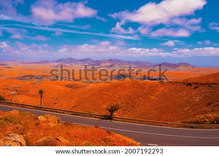 Volcanic desert 
panoramic landscape. Stylish nature banner. Travel concept. Canary islands. Fuerteventura