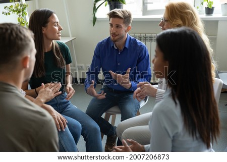 Work addict people talking on group therapy meeting, sitting in circle, discussing addiction, mental health problems. Counselor speaking, giving support and advice to team for successful recovery Royalty-Free Stock Photo #2007206873