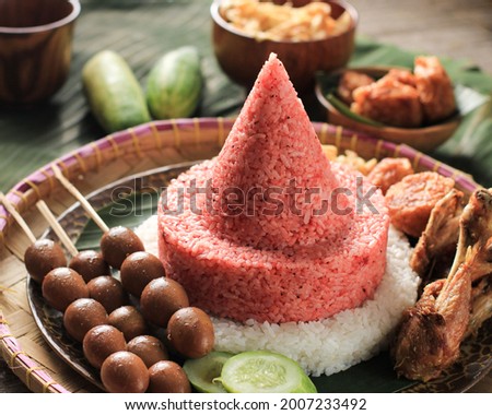 Red and White  Rice Called Nasi Tumpeng Same as Indonesian National Flag for Independence Day Celebration at 17 August Royalty-Free Stock Photo #2007233492
