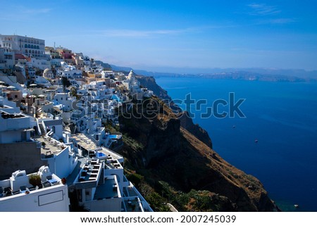 Scenery of Santorini Island, one of the Cyclades islands in the Aegean Sea. The whitewashed, cubiform houses of its 2 principal towns, Fira and Oia, cling to cliffs above an underwater caldera Royalty-Free Stock Photo #2007245039