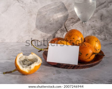 Business card on a wooden cutting board. Fruit mockup for branding for a restaurant or cafe.