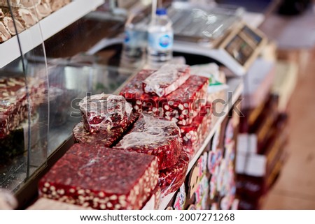 Large selection of Turkish delight in the store. An assortment of colorful Turkish delight and baklava. Turkish National Classic Dessert. High quality photo