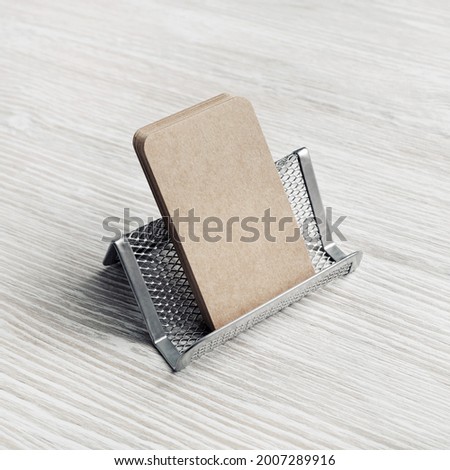 Photo of blank kraft business cards and card holder. Placing your design.