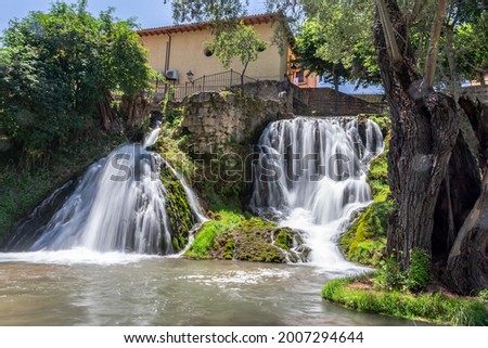 Natural waterfalls of the Cifuentes river as it passes through the town of Trillo in Guadalajara. Water falls. Waterfalls.