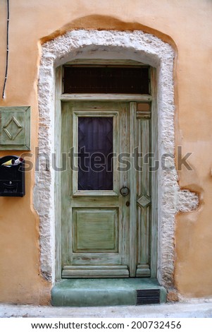 Weathered door on the old town of Chania, Crete island