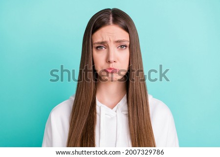 Photo of cute abused young woman dressed white hoodie crying isolated teal color background
