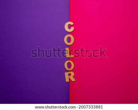 Wooden letters with the word "Color" on pink and purpple background