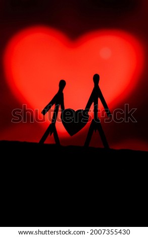 Concept of loving couples with matchsticks. Male and Female close together with beautiful heart shapes in the background. Matchstick art photography used matchsticks to create the character.