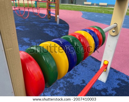 Children's developmental sports toy on the playground in the open-air courtyard.