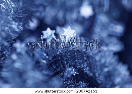 Blue tinsel Christmas decoration - close-up photo
