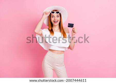 Photo of attractive young nice woman hold credit card smile customer shopper amazed isolated on pink color background