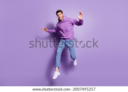 Full length body size photo man jumping up cheerful overjoyed isolated pastel purple color background Royalty-Free Stock Photo #2007495257